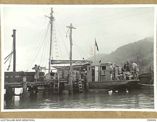 KWIARA, CHINA STRAITS, 1943-07-03. THE AK-60 OF THE 1ST AUSTRALIAN WATER TRANSPORT GROUP (SMALL CRAFT) UNLOADS SUPPLIES AFTER A RUN FROM PORT MORESBY