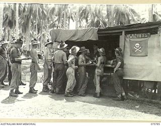 SIAR-NAGADA, NEW GUINEA. 1944-09-08. TROOPS OF THE 61ST INFANTRY BATTALION, "THE QUEENSLAND CAMERON HIGHLANDERS" PATRONIZING THE B COMPANY CANTEEN. IDENTIFIED PERSONNEL ARE:- PRIVATE T.G. BYRNES ..
