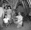 Mensalvas family under coconut tree, Punaluu, September 1961