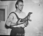 John Werler holding island monitor lizard