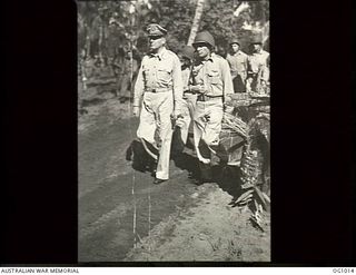 AITAPE, NORTH EAST NEW GUINEA. 1944-05-02. GENERAL DOUGLAS MACARTHUR AND HIS AIDE, COLONEL LLOYD, RETURNING ALONG A JUNGLE PATH AFTER HAVING WATCHED RAAF ENGINEERS AT WORK ON TADJI AIRSTRIP