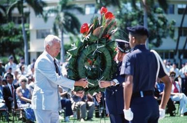 Edward C. Aldridge, Secretary of the Air Force, and General (GEN) Jack I. Gregory, Commander-In-CHIEF, Pacific Air Forces, place a wreath at the base of the flagpole during a ceremony in remembrance of American prisoners of war and those listed as missing