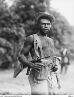 TINIAN, BOUGAINVILLE. 1945-07-18. SERGEANT LEA, IN CHARGE OF ALLIED INTELLIGENCE BUREAU NATIVES, WHO HAS A FINE RECORD OF KILLS TO HIS CREDIT