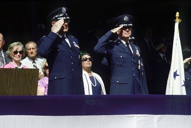 Pacific Air Forces Commander in CHIEF, LGEN James D. Hughes (right), and Air Force CHIEF of STAFF, GEN Lew Allen Jr. salute during GEN Hughes retirement ceremonies