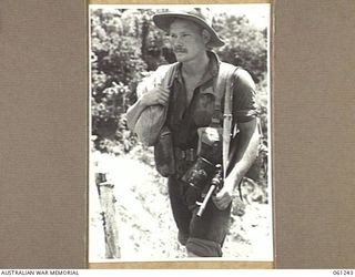 KIMBARUM, NEW GUINEA. 1943-11-30. QX19596 CORPORAL J. COLLEY OF BATHURST, NSW, AND OF THE 2/31ST AUSTRALIAN INFANTRY BATTALION