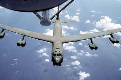 A B-52 Stratofortress aircraft approaches the refueling boom of a KC-135 Stratotanker aircraft while on a flight out of Andersen Air Force Base, Guam, during exercise Giant Warrior '89