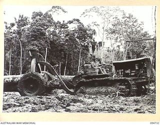YALU AREA, NEW GUINEA, 1945-07-30. LOGGING ARCH AND D8 TRACTOR OPERATED BY NO. 2 PLATOON, 2/1 FORESTRY COMPANY, ROYAL AUSTRALIAN ENGINEERS