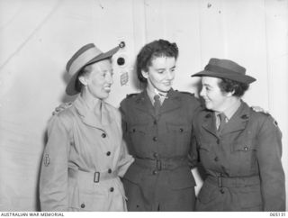 SYDNEY, NSW. 1944-03-20. PORTRAIT OF MEMBERS OF THE AUSTRALIAN ARMY MEDICAL WOMEN'S SERVICE (AAMWS) ON LEAVE FROM NEW GUINEA. LEFT TO RIGHT: PRIVATE C. STRONG (1); PRIVATE C. HATCHER (2); PRIVATE ..