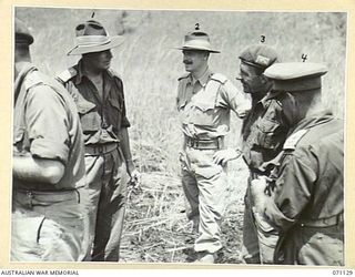 GUSIKA, NEW GUINEA. 1944-03-15. SENIOR OFFICERS ATTENDING A SHOOT HELD BY MEMBERS OF THE 1ST TANK BATTALION TO TEST THE VULNERABILITY OF A CUPOLA FITTED TO THE BODY OF A MATILDA TANK. IDENTIFIED ..