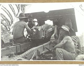 DONADABU AREA, NEW GUINEA. 1943-12-01. NO. 4 GUN OF THE 2/4TH AUSTRALIAN FIELD REGIMENT AT THE MOMENT OF FIRING DURING THE COMBINED EXERCISES WITH THE 2/10TH AUSTRALIAN INFANTRY BATTALION. SHOWN ..