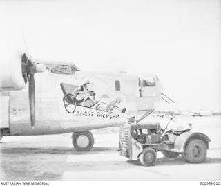 NADZAB, MARKHAM VALLEY, NEW GUINEA. 1944-02. UNITED STATES 5TH AIR FORCE (HEAVY BOMBER GROUP) WITH WHICH UNIT NO 1 WIRELESS UNIT RAAF WAS WORKING AT THAT TIME. A B24 LIBERATOR HEAVY BOMBER OF THE ..