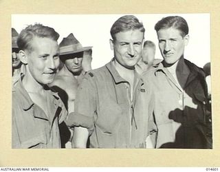 1943-04-07. NEW GUINEA. THREE AMERICAN AIRMEN RESCUED FROM ALMOST UNDER THE NOSES OF THE JAPANESE AND BROUGHT BACK TO AN ADVANCED ALLIED BASE IN NEW GUINEA AFTER TEN MONTHS IN THE MOUNTAINS OF NEW ..