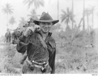 SUAIN PLANTATION, NEW GUINEA. 1944-12-06. PRIVATE H.J. HUNT, A COMPANY, 2/4 INFANTRY BATTALION, (1), RETURNING WET FROM WATER CROSSINGS DURING A PATROL ALONG THE DANMAP RIVER WHICH HAD COMMENCED AT ..