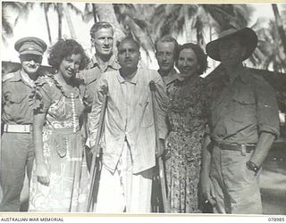 AITAPE, NEW GUINEA. 1945-02-20. SUBADAR NAND SINGH, A SIKH MEMBER OF THE 5/2ND PUNJAB REGIMENT (1) WHO WAS CAPTURED BY THE JAPANESE AT THE FALL OF SINGAPORE, WITH MR DICK BENTLEY (2) MISS PAULINE ..