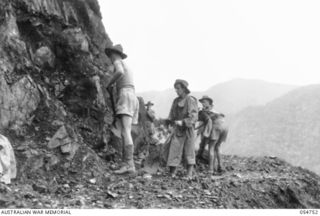 BULLDOG ROAD, NEW GUINEA. 1943-07-18. 2/1ST AUSTRALIAN FIELD COMPANY, ROYAL AUSTRALIAN ENGINEERS, MAKING A TRACK ALONG THE CLIFF FACE AT FOX GAP. ALL THIS IS HAND WORK AS NO MECHANICAL EQUIPMENT IS ..