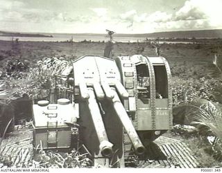 NEW BRITAIN, 1945-09. A JAPANESE TWIN BARRELLED GUN IN THE RABAUL AREA. (RNZAF OFFICIAL PHOTOGRAPH.)