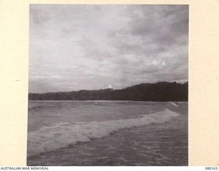 SATTELBERG, NEW GUINEA. 1944-07-06. THE COASTLINE NEAR THE SATTELBERG AREA. THE PHOTOGRAPH WAS TAKEN FOR USE BY VX76415 LIEUTENANT R.B. EWERS, OFFICIAL WAR ARTIST, MILITARY HISTORY SECTION