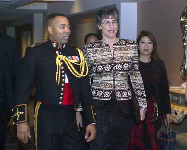 The Honorable Linda Lingle, right, Governor of Hawaii, is escorted by US Marine Corps (USMC) Captain (CAPT) John Lynch, at the USMC Officer Ball, celebrating the 228th anniversary of the founding of the Marine Corps