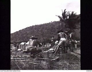 PYRAMID POINT, NEW GUINEA. 1943-11-01. TROOPS WORKING ON THE CONSTRUCTION OF THE FOUNDATION PILES FOR THE NEW SERVICE WOMEN'S HOSTEL