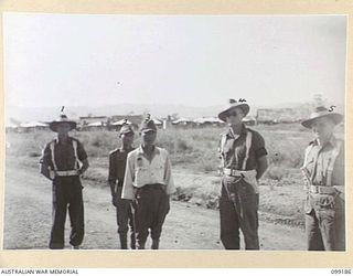 CAPE WOM, NEW GUINEA, 1945-12-01. LIEUTENANT TAZAKI (3) WAITING TO GO BEFORE THE COURT. HE WAS TRIED AND SENTENCED TO DEATH FOR MUTILATING AND EATING THE FLESH OF AN AUSTRALIAN SOLDIER KILLED IN ..
