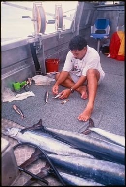 Man in a fishing boat, Niue