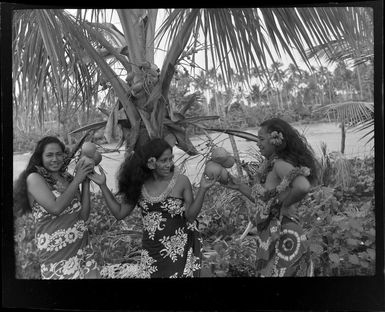 Unidentified women holding coconuts, Aggie Grey's Hotel, Apia, Samoa