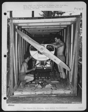 Men Uncrate A Vultee L-5 Of The 163Rd Liaison Squadron At Cub Field No. 7 On Okinawa, Ryukyu Retto. The Plane, Which Has Been Partially Dismantled And Crated, Was Shipped To This Advanced Base From Hawaii. 1945. (U.S. Air Force Number 64724AC)