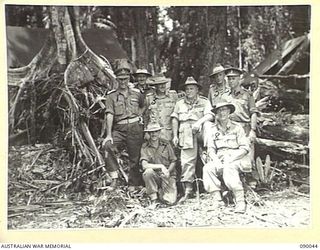 BOUGAINVILLE. 1945-03-26. GENERAL SIR THOMAS A. BLAMEY, COMMANDER-IN-CHIEF, ALLIED LAND FORCES, SOUTH WEST PACIFIC AREA (4), WITH A GROUP OF SENIOR OFFICERS AT ADVANCED HEADQUARTERS 7 INFANTRY ..