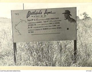 BONGA - WAREO TRACK, FINSCHHAFEN AREA, NEW GUINEA. 1944-03-13. ONE OF MANY BATTLE SIGNS IN THE FINSCHHAFEN AREA, THIS SIGN RECORDS ACTIVITIES OF THE 26TH INFANTRY BRIGADE