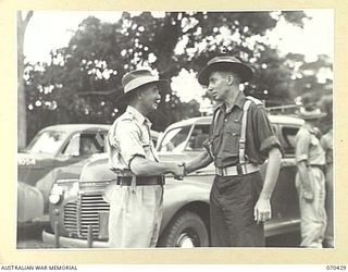 POM POM VALLEY, NEW GUINEA, 1944-02-16. NX8 LIEUTENANT-GENERAL SIR LESLIE MORSHEAD, KCB., KBE., CMG., DSO., ED., (1) GENERAL-OFFICER-COMMANDING NEW GUINEA FORCE, SHAKES HANDS WITH BRIGADIER I.N. ..