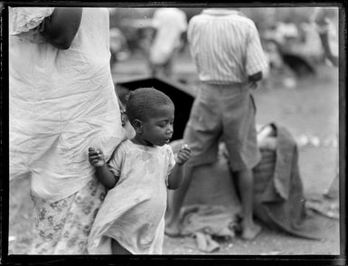 A young child at an outdoor market, Suva, Fiji