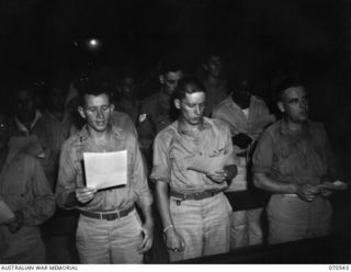 PORT MORESBY, PAPUA, 1944-02-20. AUSTRALIAN AND AMERICAN SERVICEMEN PICTURED DURING A SERVICE AT THE ROMAN CATHOLIC CHURCH