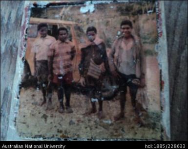 A photograph of a 32-year-old polaroid print of four of the six Febi youths who visited Koroba, in the Southern Highlands (now Hela) Province of Papua New Guinea in 1979