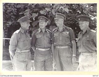 BOUGAINVILLE. 1945-09-26. MAJOR GENERAL W. BRIDGEFORD, GENERAL OFFICER COMMANDING 3 DIVISION, WITH HIS UNIT COMMANDERS