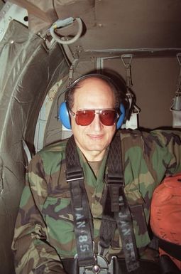 George Barbis, the Department of the Army's political advisor, sits aboard a helicopter during a flight to the Pohakuloa Training Area from Schofield Barracks. Barbis is accompanying Army CHIEF of STAFF General (GEN) Carl E. Vuono on an official visit