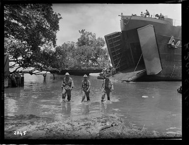 Group, including General Harold Barrowclough, wading ashore on Nissan Island, Papua New Guinea, during World War II