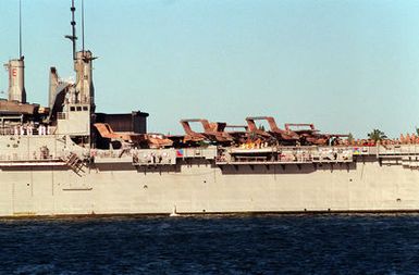 Several Marine Corps OV-10 Bronco aircraft sit on the flight deck of the amphibious transport dock USS JUNEAU (LPD-10) as it arrives for a visit to the naval station. The JUNEAU is stopping at Pearl Harbor while en route to its home port of Naval Station, San Diego, Calif., after serving in the Persian Gulf region during Operation Desert Shield and Operation Desert Storm.