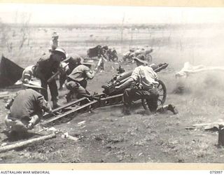 NADZAB AREA, NEW GUINEA. 1944-09-15. MEMBERS OF THE 2ND MOUNTAIN BATTERY FIRING THEIR 75MM GUN DURING A PRACTICE SHOOT. IDENTIFIED PERSONNEL ARE: SERGEANT CRANSTON (1); TROOPER A.S. DAWSON (2); ..