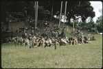 Dancers with shields; large official gathering