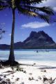 French Polynesia, view of bay and mountain peaks from beach on Bora Bora