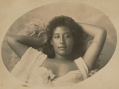 Samoan woman reclining on 'ie sina
