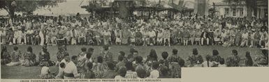 Cruise passengers watching an entertaining display provided by the natives at Nukualofa