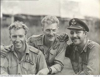 VIVIGANI, GOODENOUGH ISLAND, PAPUA. 1943-10-12. MEMBERS OF NO. 30 (BEAUFIGHTER) SQUADRON RAAF WHO TOOK PART IN AIR ATTACKS ON RABAUL. LEFT TO RIGHT: FLYING OFFICER (FO) JOHN MCROBBIE, LEEDERVILLE, ..