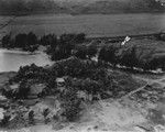 Aerial view of Kawela Bay, Oahu, Hawaii after a tsunami hit this part of the island. Arrow on the photograph is where Francis Parker Shepard a geologist from Scripps Institution of Oceanography was when the waves hit this area. April 1946