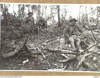 SATTELBERG AREA, NEW GUINEA. 1943-11-18. MEN OF C COMPANY, 2/48TH AUSTRALIAN INFANTRY BATTALION SETTING INTO THEIR NEWLY CAPTURED POSITIONS. THEY ARE LEFT TO RIGHT: UNKNOWN. VX83010 PRIVATE H. ..