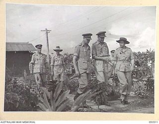 TOROKINA, BOUGAINVILLE. 1945-07-03. HIS ROYAL HIGHNESS, THE DUKE OF GLOUCESTER, GOVERNOR-GENERAL OF AUSTRALIA (1) IN THE GARDEN AT 2/1 GENERAL HOSPITAL. IDENTIFIED PERSONNEL ARE:- LIEUTENANT ..