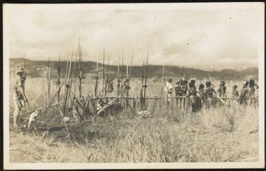 The natives of Wahgi came to vist the expedition party, D. J. Leahy at left and Jim Taylor at right, Central New Guinea, 1933