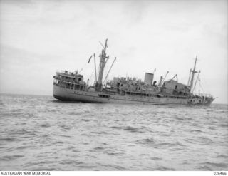 OFF PORT MORESBY, PAPUA. 1942-08-30. THE M.V. MALAITA SHORTLY AFTER SHE HAD BEEN TORPEDOED BY AN ENEMY SUBMARINE OFF PORT MORESBY ONLY ONE CASUALTY WAS SUSTAINED - THE CHIEF STEWARD WITH TWO BROKEN ..