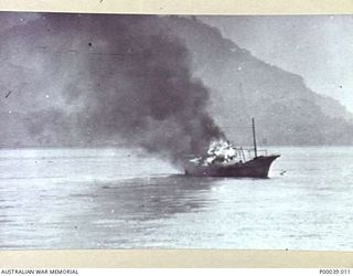 SORONG, DUTCH NEW GUINEA WWII. JAPANESE VESSEL BURNING NEAR SORONG