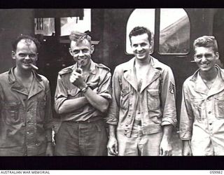 PORT MORESBY, NEW GUINEA. 1943-11-14. TEST PHOTOGRAPH TAKEN BY SERGEANT R. J. BUCHANAN, PHOTOGRAPHER, MILITARY HISTORY SECTION SHOWING THREE UNITED STATES SOLDIERS AND WARRANT OFFICER R. IRVING, ..
